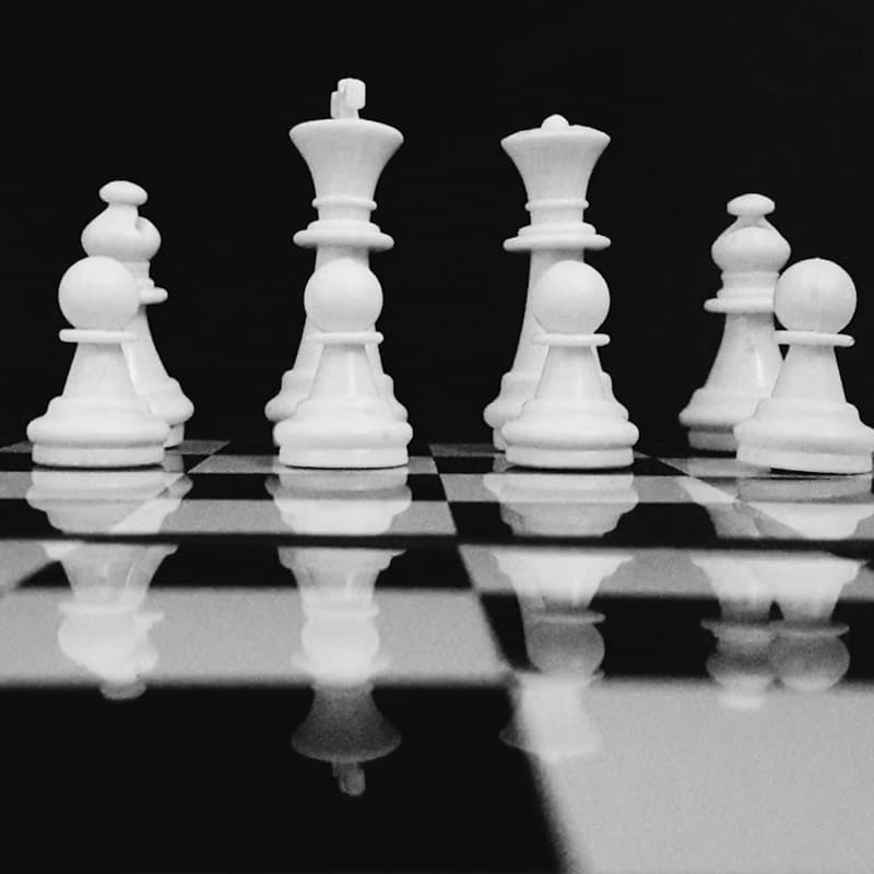 Chess pieces on a board, representing strategic thinking